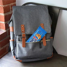 Chocolate chip cookie pack tucked into a gray backpack pocket