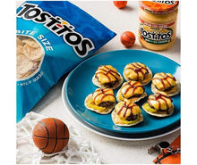 Tostitos bite-size cheese chips with queso on blue plate