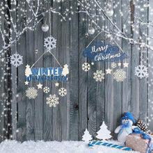 Hanging Christmas ornaments with snowflake and text cutout designs