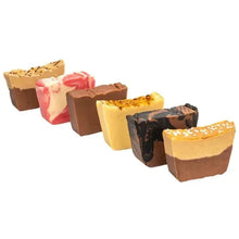 Assorted fudge cubes in dark, tan, caramel, and pink swirls