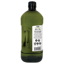 Avocado oil bottle with black cap, green glass; back label text and icons.