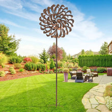 Metal pinwheel wind spinner with brown circular blades and center finial on tall pole.