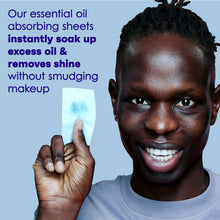 Oil absorbing sheets held near face to absorb excess oil