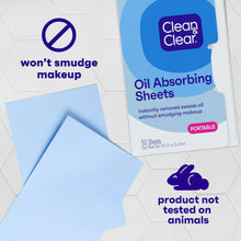 Oil absorbing sheets loose beside a portable Clean & Clear pack