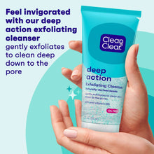 Turquoise Clean & Clear deep action exfoliating cleanser tube held in hands
