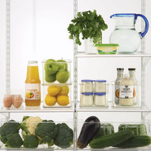 Clear plastic organizer bins with open fronts, holding pantry items