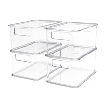 Four clear plastic stackable storage bins with hinged lids and front pull handles