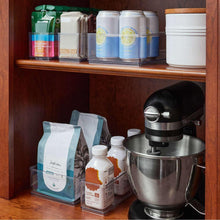 Clear 6-piece organizer set with clear bins holding kitchen items and bottles in drawer