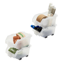 Two clear stacking storage bins holding spools and small household items