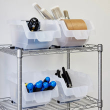 White stacking storage bins on a metal rack with compartments for brushes, blue items, and tools.