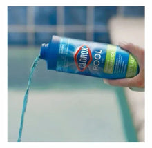 Clorox Pool Awesome Algaecide bottle tilted with blue liquid pouring