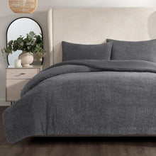 Gray comforter set with matching square pillows and shams, textured bouclé