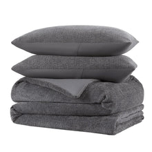 Gray bouclé comforter set with two pillow shams, neatly stacked