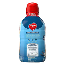 Coffee-mate creamer bottle, blue with red cap, back label with text and icons.