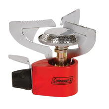 Coleman single burner stove with red canister, metal burner head, and wind guards