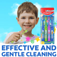 Kids toothbrush pack with four ocean explorer brushes; one brush held by child