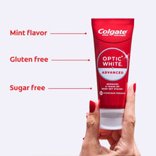 Colgate Optic White Advanced toothpaste tube in hand, red color, mint flavor shown