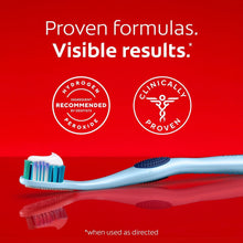 Toothbrush with toothpaste on red background, Colgate hydrogen peroxide formulas