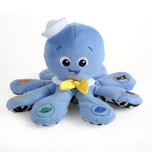 Blue plush octopus toy with big eyes and yellow bow