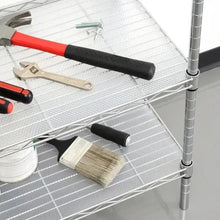 Wire shelf covered with white shelf liner, with paint tools and roller visible