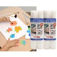 Shelf liner sheet being decorated with paint and stencil, with Con-Tact liner rolls