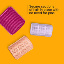 Assorted self-grip hair rollers: magenta, white, and peach with textured grip