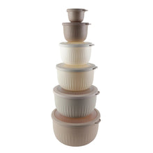 Nesting mixing bowl set, stacked off-white ribbed bowls with lids