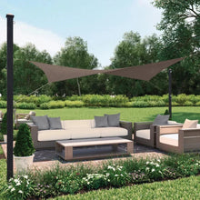 Brown rectangle shade sail stretched on posts over patio seating