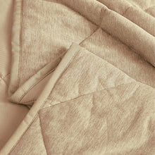 Beige quilted cooling blanket close-up of stitched fabric texture and corner fold