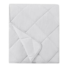 Light gray quilted cooling throw blanket with diamond stitch pattern