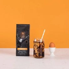 Ethiopian light roast whole bean coffee bag with iced drink in a jar