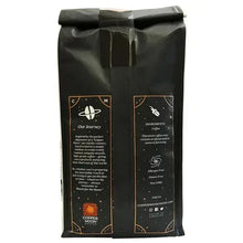 Two coffee bags with Ingredients and Our Journey panels, black packaging