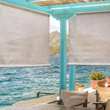 Outdoor sun shade fabric panels, light beige, mounted over a porch opening