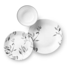 White glass dinner plate with gray botanical leaf pattern and thin rim