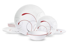 White glass dinnerware set with red and gray swirl motifs, assorted plates and bowls