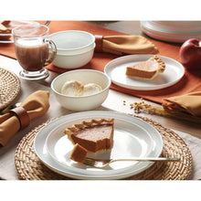 White round dinner plates and bowls with modern rim, part of a 12-piece set