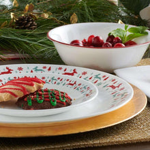 White dinner plate and bowl with red-and-green reindeer holiday border