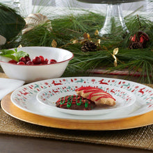White dinner plate with red-and-green reindeer border and serving bowl