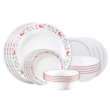 Stack of white dinner plates with red and green reindeer wreath trim