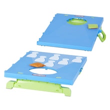 Blue foldable cornhole board with target cutouts and green handle, orange bean bags