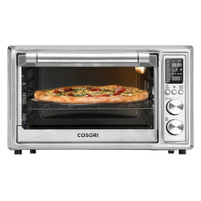 COSORI stainless steel toaster oven with a pizza baking inside