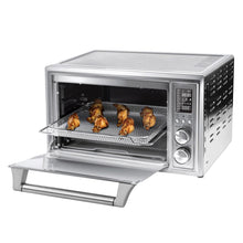 COSORI stainless steel smart toaster oven with open door and roast chicken on a wire rack
