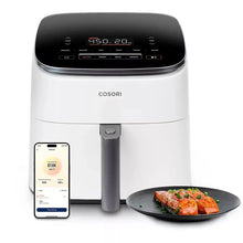 COSORI TurboBlaze smart air fryer with smartphone control and cooked food on tray