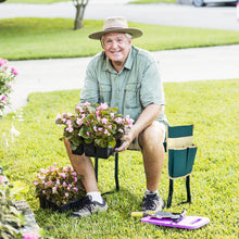 Green garden kneeler with cushioned seat pad and attached tool pouch, black folding frame
