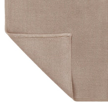 Beige cotton woven bath mat edge detail with neat border stitching