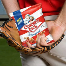 Original snack bag held in hands, showing logo and crackers artwork