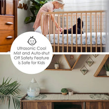 Ultrasonic cool mist drop humidifier on a tabletop with transparent mist chamber