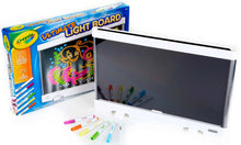Crayola light board toy with open panel and colored markers