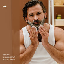 Cremo 2-in-1 beard and face wash being applied with lather on a man’s beard