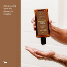 Cremo 2-in-1 shampoo and conditioner bottle dispensing onto hands